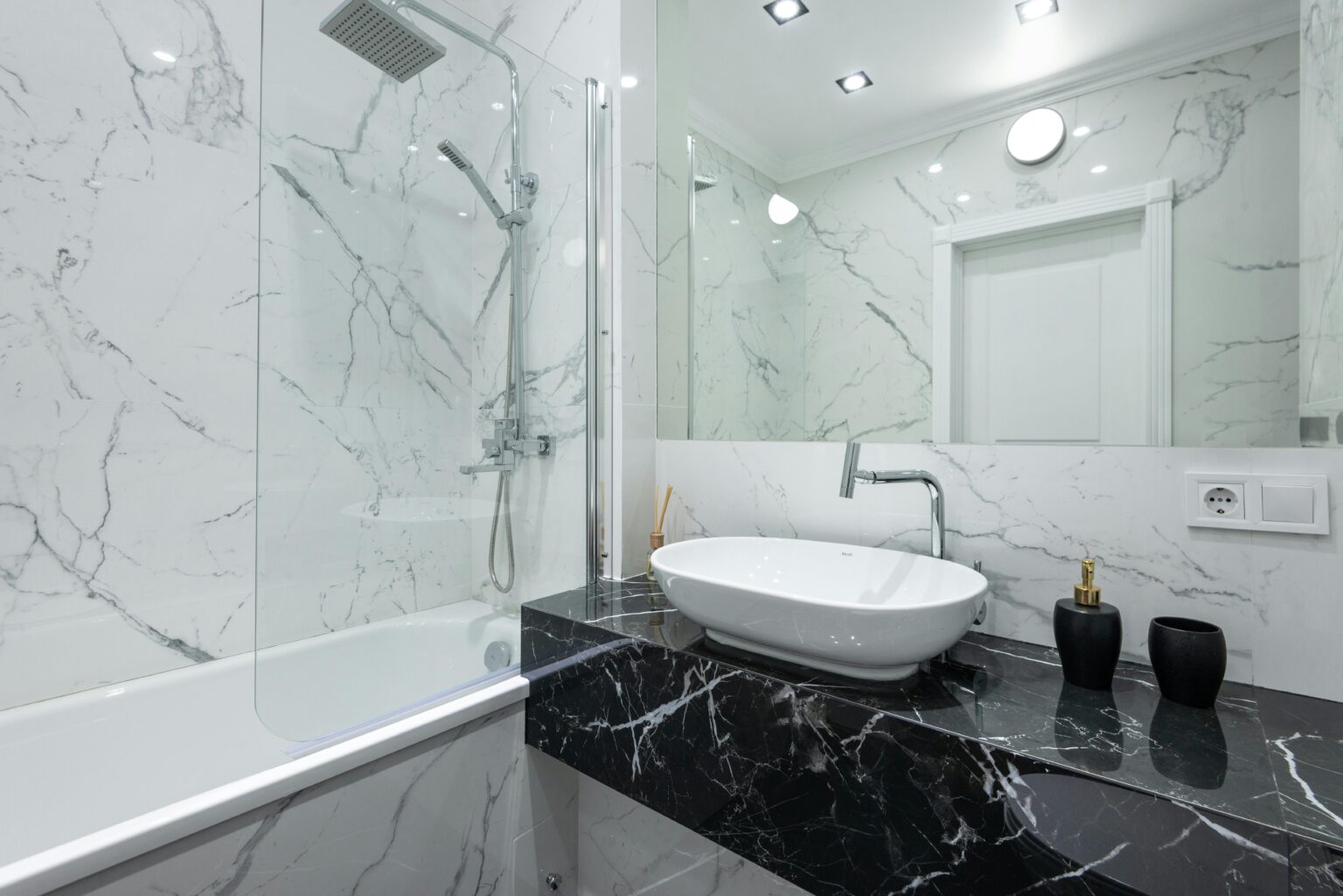 Spotless bathroom with a black marble vanity. The best apartment cleaning services in Dover