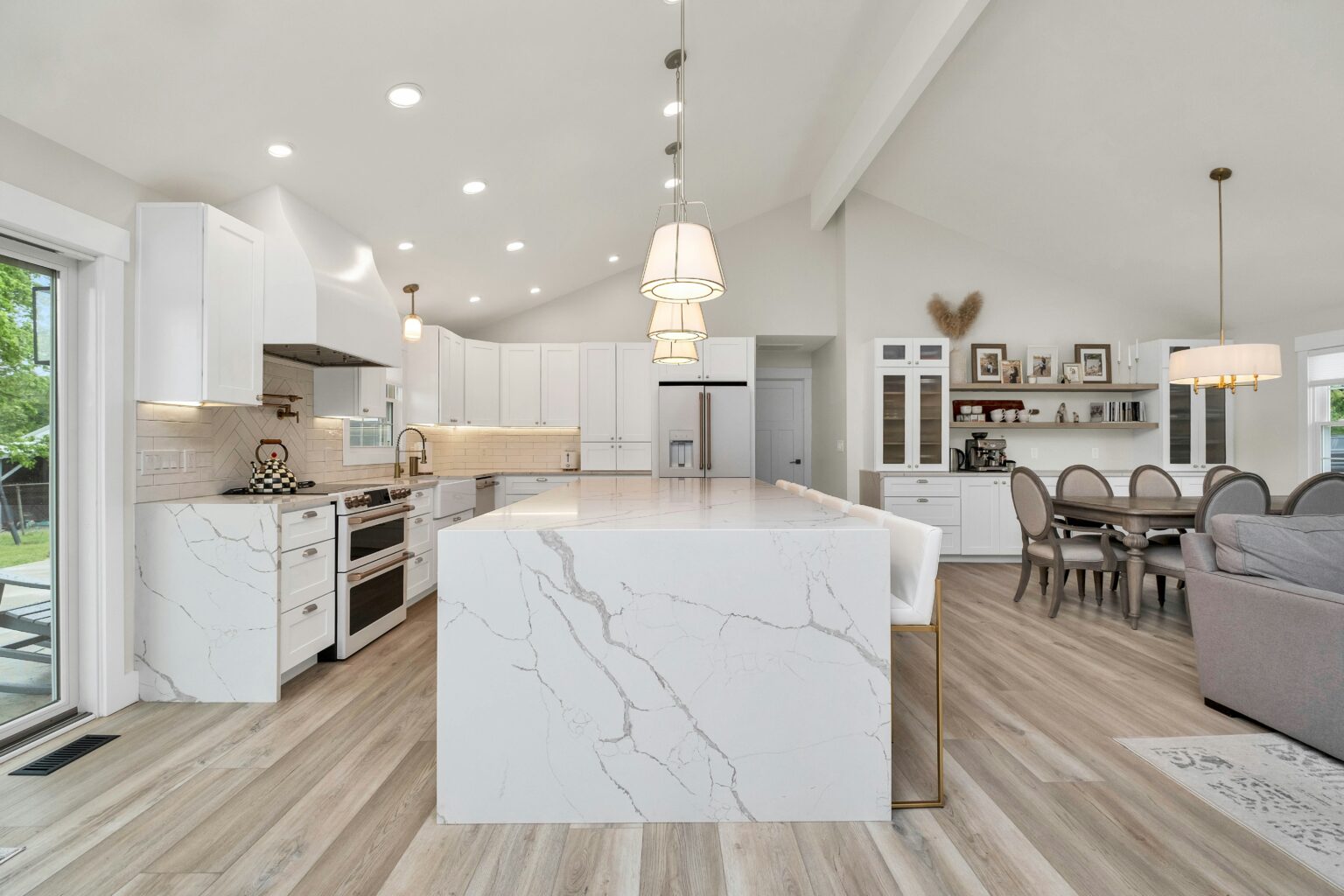 The best house cleaning service in Kittery. Large kitchen with a central marble island and pendant lighting