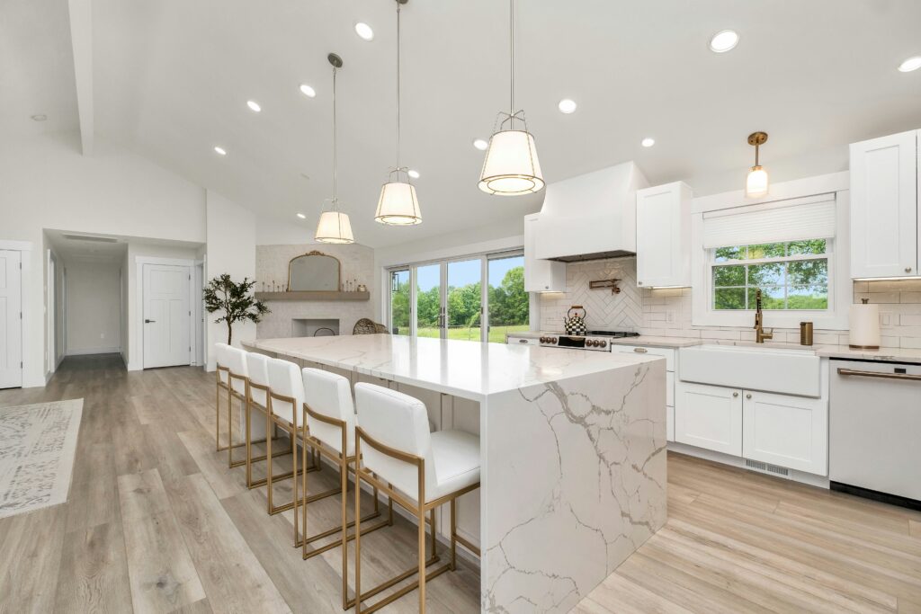 pristine kitchen with large central island and pendant lighting. best house cleaning service in the Seacoast Region