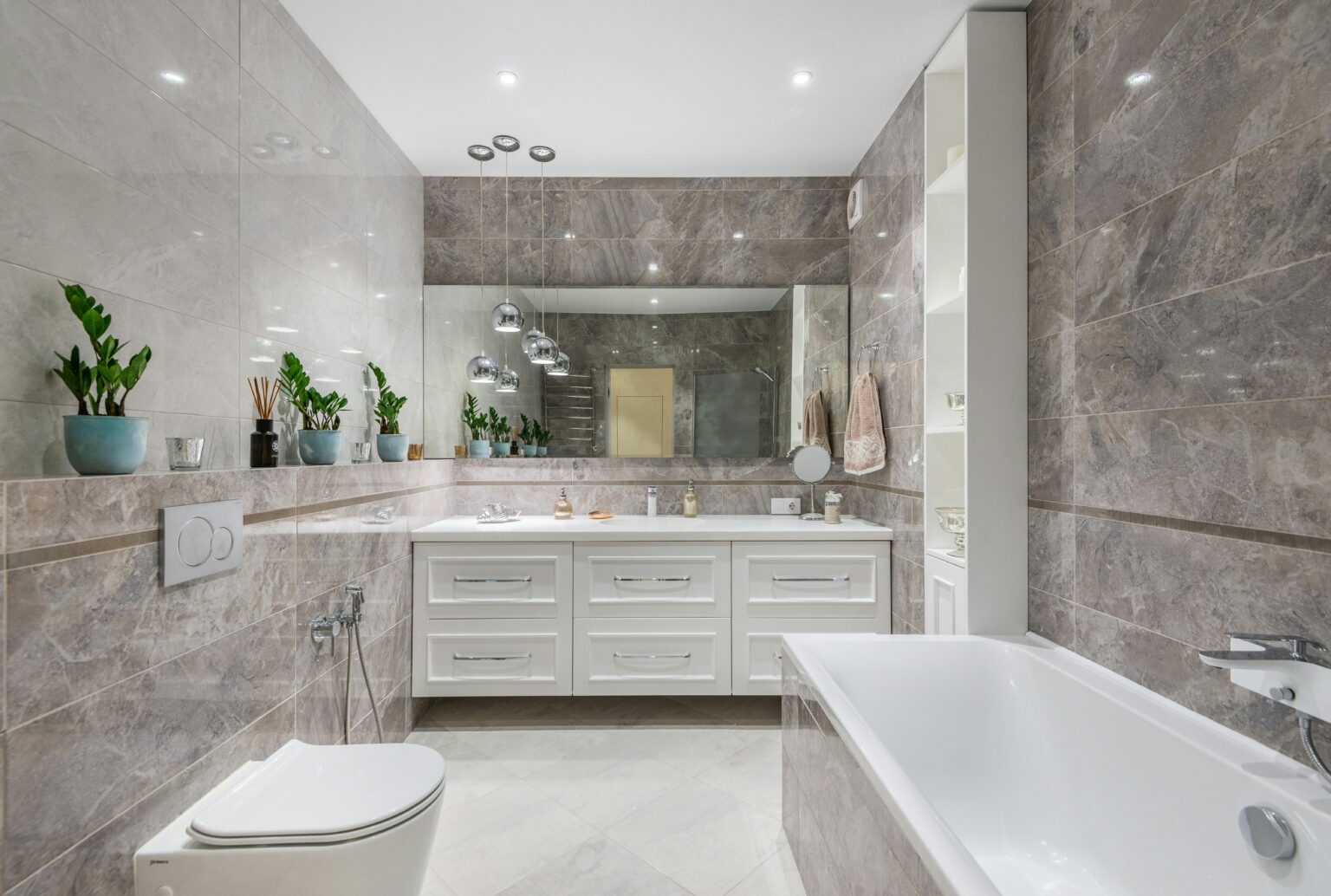 Bathroom with tan stone walls. Best house cleaning service in Hampton
